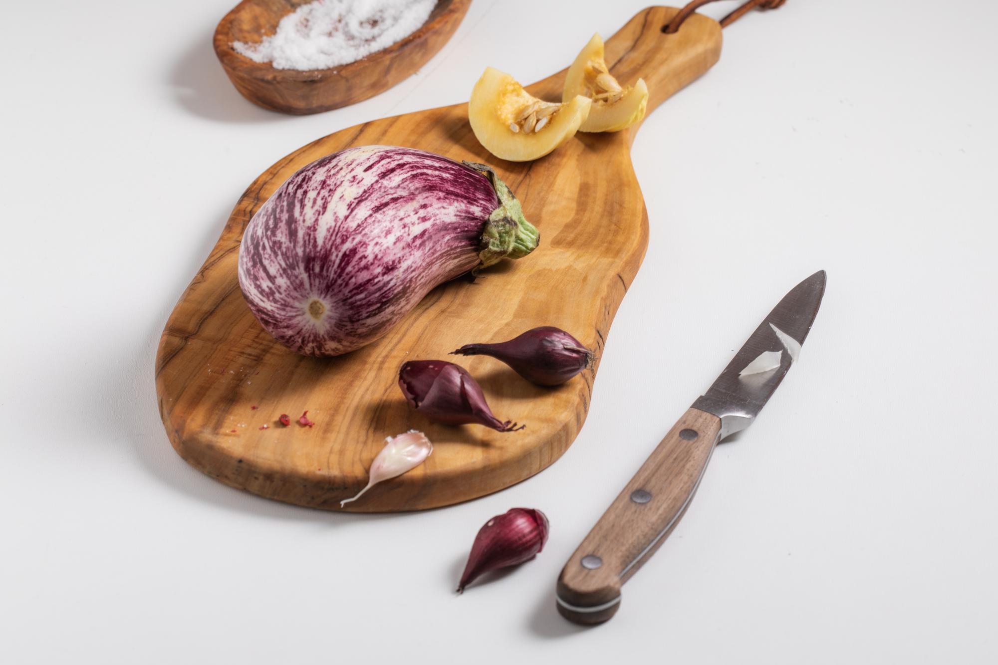 Close-up of knife slicing herbs